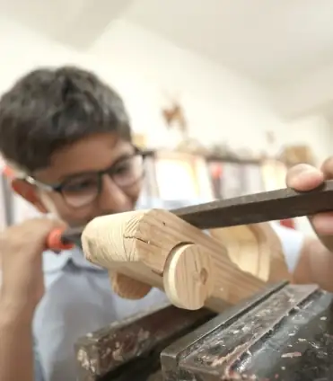 Nalanda school student wood carving