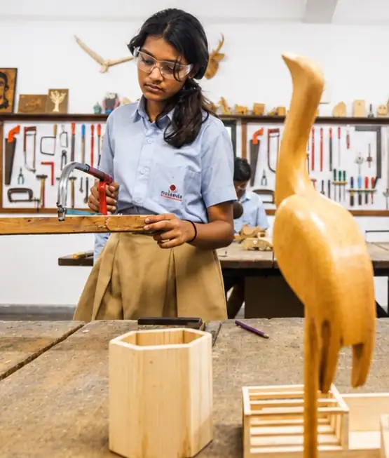 Nalanda school student wooden sculpture